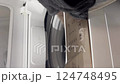 Remove the laundry from the washing machine 124748495