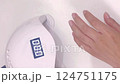Put your hands under the nail light to harden 124751175