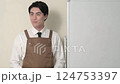 A Japanese man in an apron giving an explanation 124753397