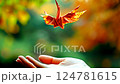 Origami Crane Taking Flight Symbol of Hope and Freedom - Autumn Background 124781615