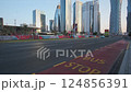 Doha, Qatar- May 3 2022:  Qatar preparation for FIFA world cup 2022 with  the flags of the participating football teams displayed in Omar AL Mukhtar street in Doha, Qatar  daylight view 124856391