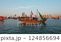 Doha, Qatar - November 24 2022: Katara Twelfth traditional dhow festival in Doha Qatar afternoon shot showing Traditional dhows in Arabic gulf with flags of countries of FIFA Word cup 2022  124856694