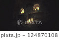 Mysterious underground space with flickering candles at night 124870108