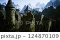 Majestic ruins of a medieval castle surrounded by mountains in daylight 124870109