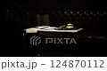 Elegant tea setting on a vintage table in a cozy study during evening hours 124870112