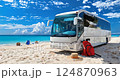 Travelling bus on the beach driving along the road by the sea. 124870963
