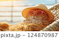 cat in sunglasses and beach hat relaxing sitting on deckchair on vacation trip. 124870987