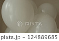 Bunch of white latex round balloons composition on tapes for holiday birthday, valentines day, aniversary party gift. Floating object. Inflatable ball by helium gas. party decor. Camera moving down 124889685