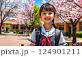 little asian kid in school uniform with backpack on school background, smiling japanese girl on street, chinese teenager, korean student, child 124901211