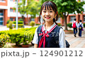 little asian kid in school uniform with backpack on school background, smiling japanese girl on street, chinese teenager, korean student, child 124901212