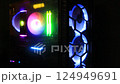 Top-end system unit for gaming PC computer. Inside of led illuminated dark cyber club. Concept of modern tech, e fun, e sport, on-line video games internet club, no people 124949691
