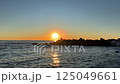 Sunset horizon over sea near water. View of beautiful evening sunset in sky over sea. 125049661