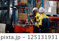 Warehouse workers are inspecting goods inside the warehouse. 125131931