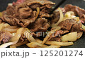 Meat onion cooking image 125201274