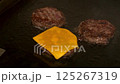 A burger patty being fried. Slow motion. 125267319