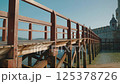 Wood bridge to Belem Tower in Portugal. 125378726