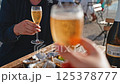 people drink champagne and eat oysters 125378777