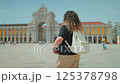 Woman walking Commerce Square Portugal. 125378798