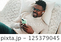 black man with smartphone use video call 125379045