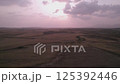 Sweeping Drone Views of Fields and Mountains Bathed in Sunset in Lefkosa, Northern Cyprus 125392446