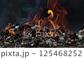 Fierce flames burn trash, leaving it charred and ash.AI Generated 125468252