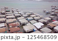 Aerial drone shot of Hanuabada village in Capital City Port Moresby, Papua New Guinea. Koki Stilt village. Motu tribe. Plenty of garbage everywhere. High quality 4k footage 125468509