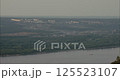 Barge navigating Volga river near Samara, Russia during hazy day 125523107