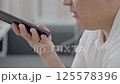 Dubai, UAE- 25.04.2025: Adult male using OPEN AI ChatGPT on a smartphone. Artificial intelligence technology. Smartphone closeup. Male hands using AI on phone. High quality 4k footage 125578396