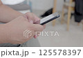 Dubai, UAE- 25.04.2025: Adult male using OPEN AI ChatGPT on a smartphone. Artificial intelligence technology. Smartphone closeup. Male hands using AI on phone. High quality 4k footage 125578397