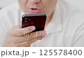 Dubai, UAE- 25.04.2025: Adult male using OPEN AI ChatGPT on a smartphone. Artificial intelligence technology. Smartphone closeup. Male hands using AI on phone. High quality 4k footage 125578400