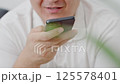 Dubai, UAE- 25.04.2025: Adult male using OPEN AI ChatGPT on a smartphone. Artificial intelligence technology. Smartphone closeup. Male hands using AI on phone. High quality 4k footage 125578401
