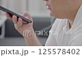 Dubai, UAE- 25.04.2025: Adult male using OPEN AI ChatGPT on a smartphone. Artificial intelligence technology. Smartphone closeup. Male hands using AI on phone. High quality 4k footage 125578402