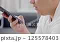 Dubai, UAE- 25.04.2025: Adult male using OPEN AI ChatGPT on a smartphone. Artificial intelligence technology. Smartphone closeup. Male hands using AI on phone. High quality 4k footage 125578403