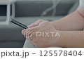 Dubai, UAE- 25.04.2025: Adult male using OPEN AI ChatGPT on a smartphone. Artificial intelligence technology. Smartphone closeup. Male hands using AI on phone. High quality 4k footage 125578404