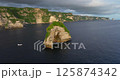 Bali Nusa Penida Banah Cliff Point rock arch aerial drone sea coast sunset 125874342
