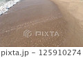 Sea waves on the sand beach 125910274
