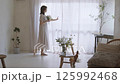 A woman adorning flowers 125992468
