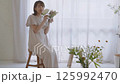 A woman adorning flowers 125992470