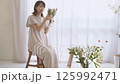 A woman adorning flowers 125992471