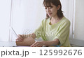 Woman doing work at home 125992676