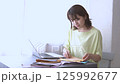Woman doing work at home 125992677