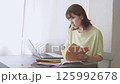 Woman doing work at home 125992678