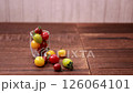Colorful mini tomatoes rolling around 126064101
