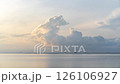 Timelapse of moving clouds during morning sunrise over the ocean 126106927