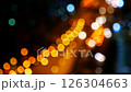 Bokeh abstract blurred background festive traffic yellow orange green red lights on road 126304663