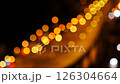 Bokeh abstract blurred background festive traffic yellow orange green red lights on road 126304664