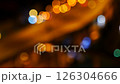 Bokeh abstract blurred background festive traffic yellow orange green red lights on road 126304666