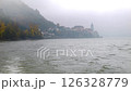 Moving on the foggy river Danube looking at Duernstein in Austria in autumn 126328779