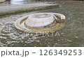 wishing fountain with coins resting underwater 126349253
