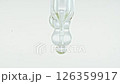 Close up of air bubbles in liquid. Pipette with serum, gel, oil. Beauty laboratory, medicine. Natural extract, cosmetic product. Macro shot 126359917